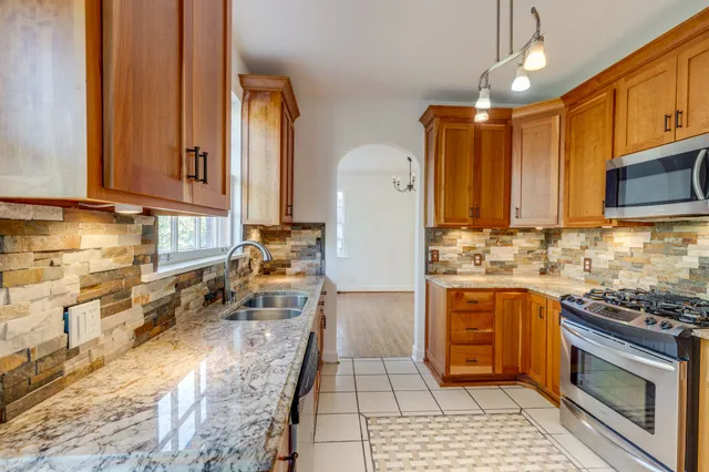 an empty room with wooden floor and closet