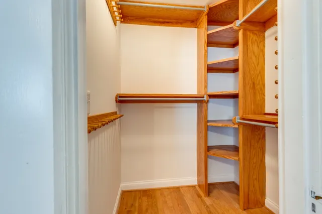 a large kitchen with stainless steel appliances granite countertop a large counter top and a sink