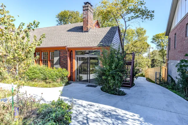 a front view of a house with garden