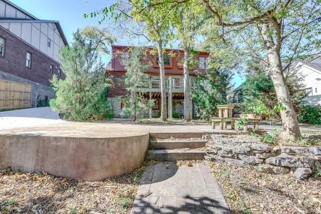 a view of a fountain in front of a house