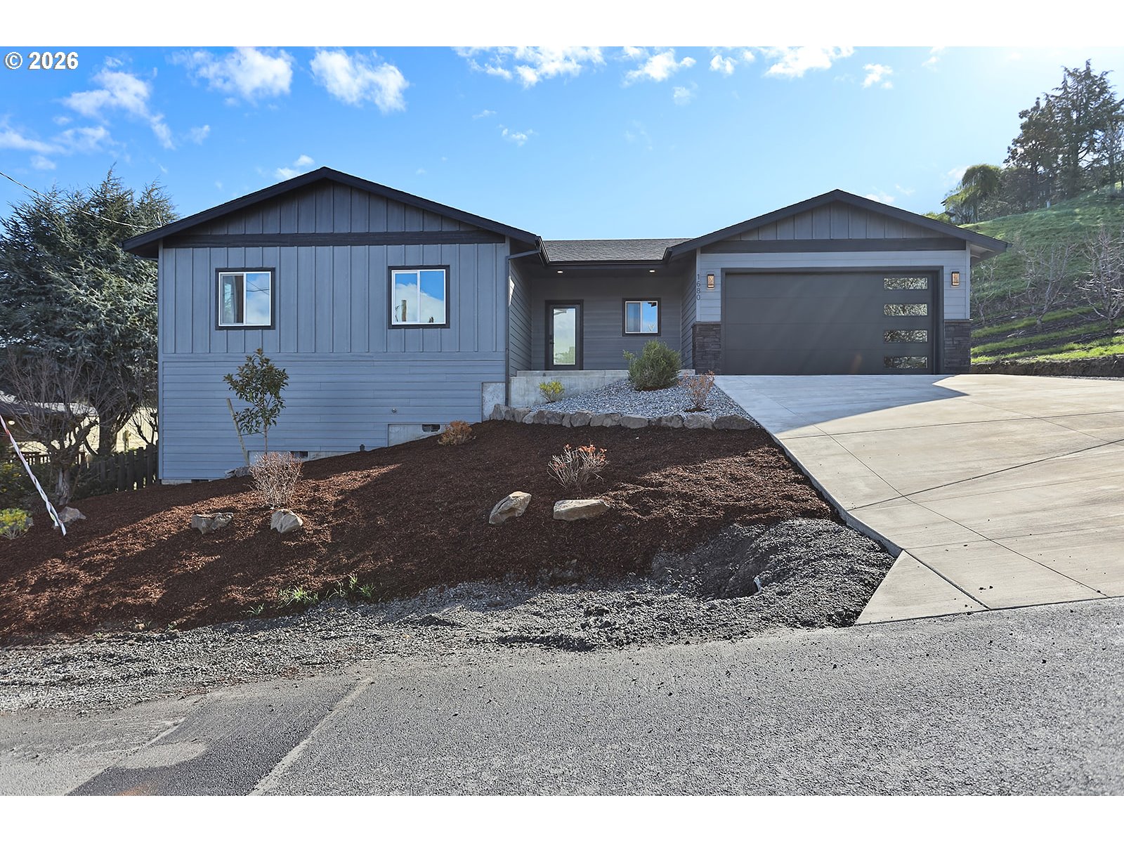 1680 Morton Street The Dalles, OR 97058 - Photo 1 of 36 a front view of a house with a yard