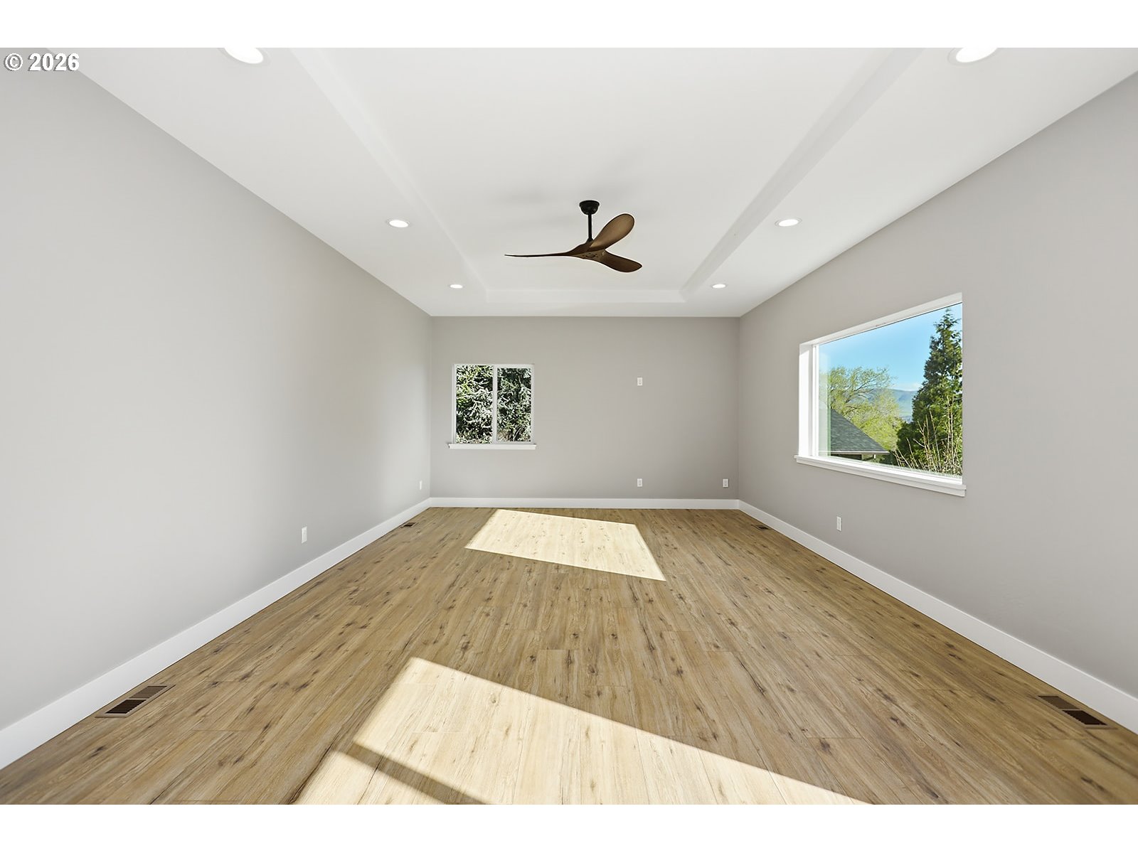1680 Morton Street The Dalles, OR 97058 - Photo 15 of 36 an empty room with wooden floor and windows