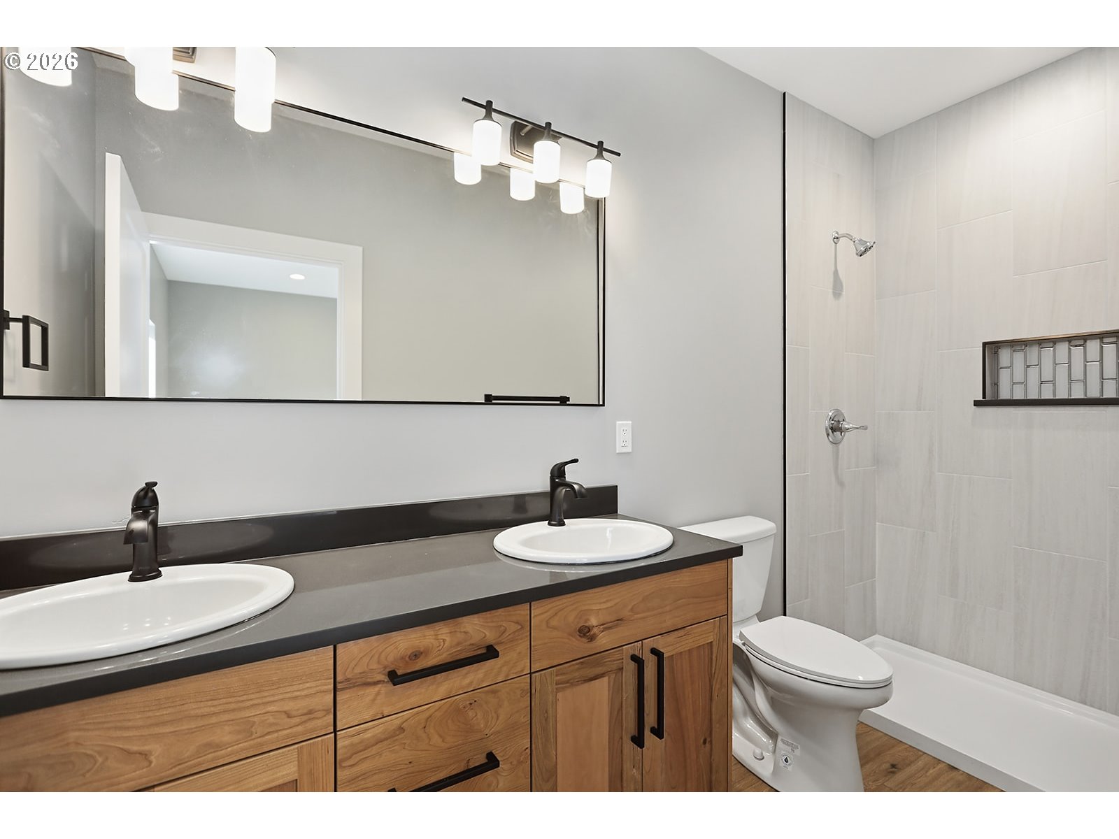 1680 Morton Street The Dalles, OR 97058 - Photo 21 of 36 a bathroom with a sink a toilet and a mirror