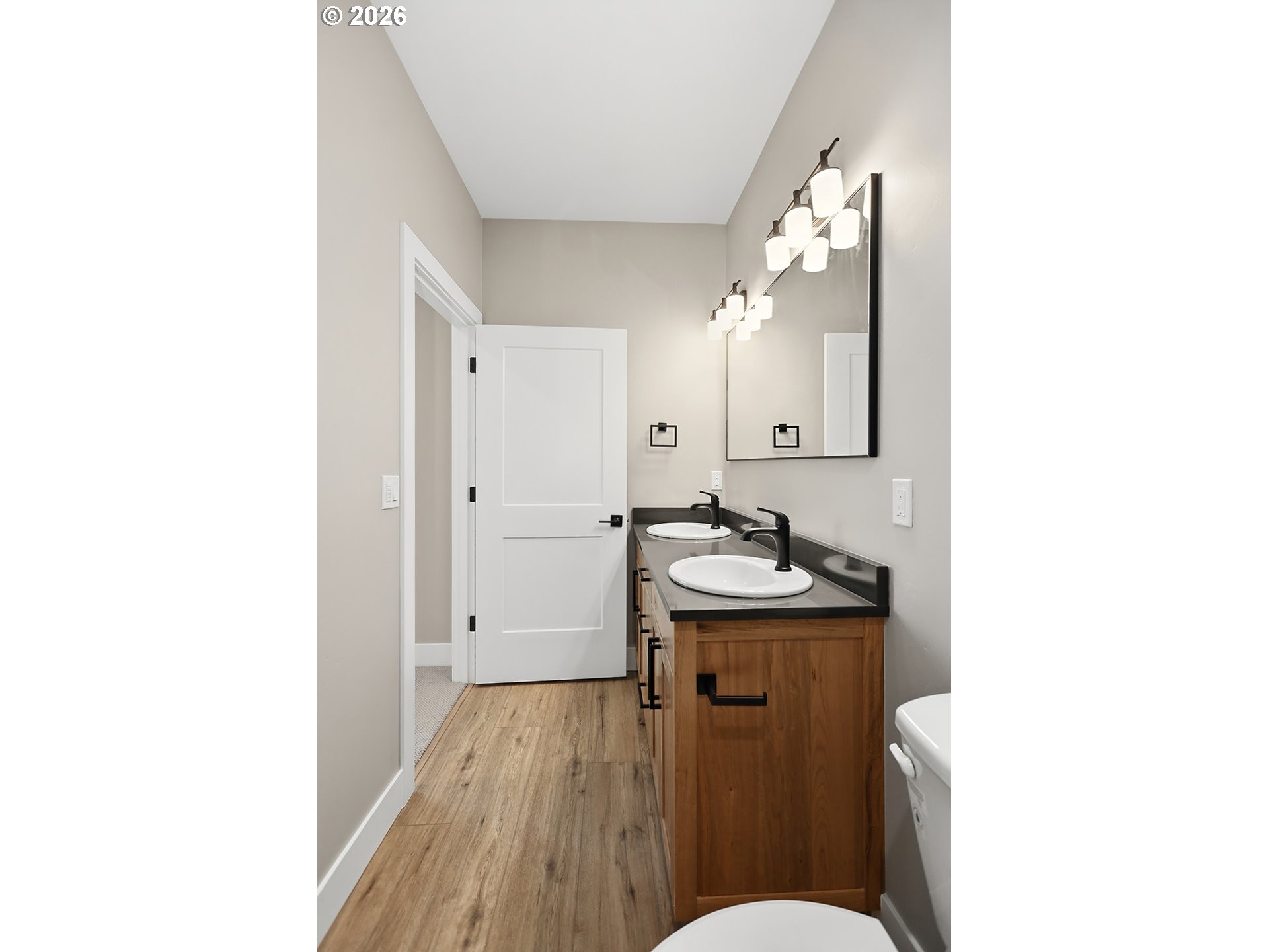 1680 Morton Street The Dalles, OR 97058 - Photo 23 of 36 a bathroom with a sink and mirror with toilet