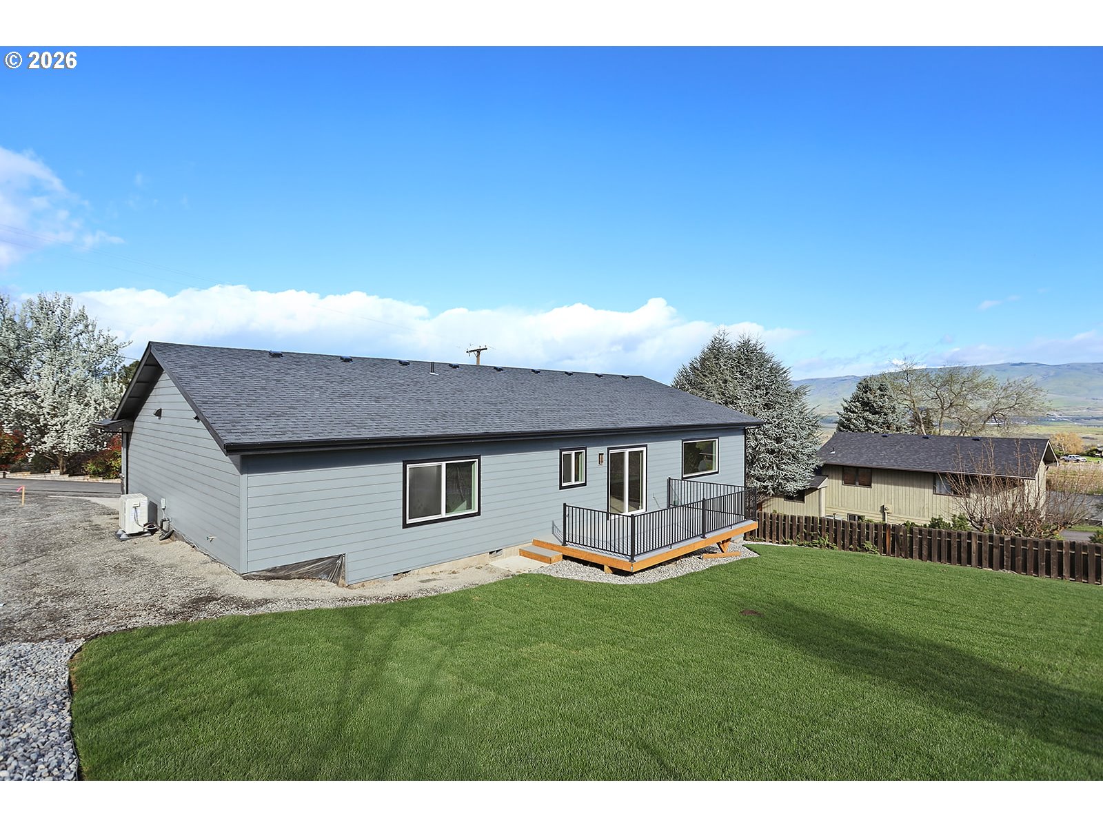 1680 Morton Street The Dalles, OR 97058 - Photo 3 of 36 a front view of a house with a garden and yard