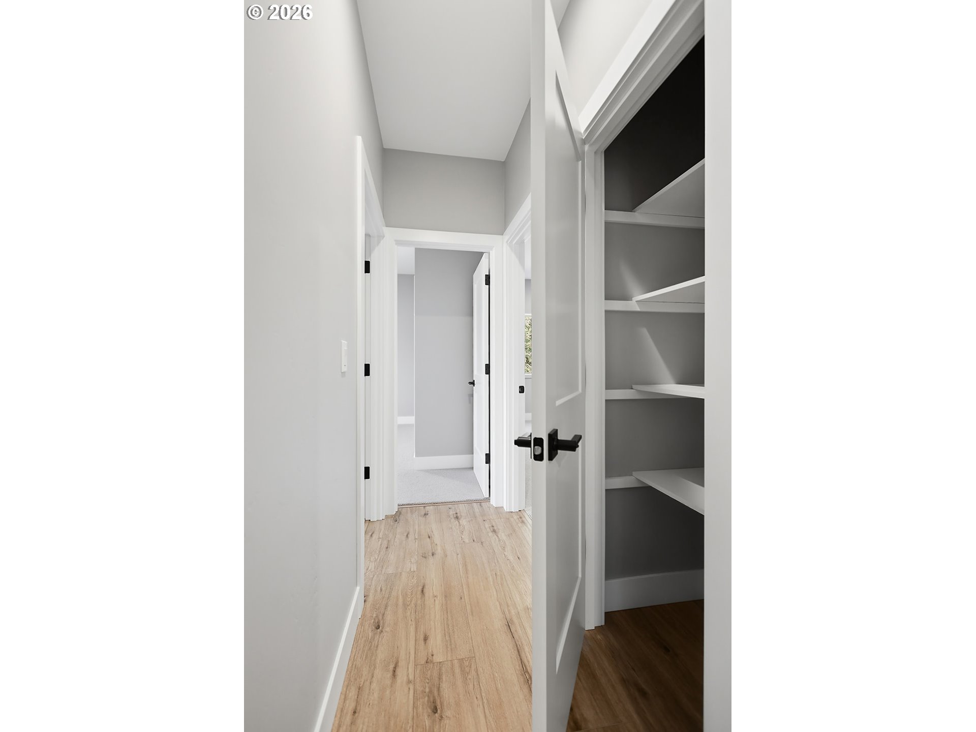 1680 Morton Street The Dalles, OR 97058 - Photo 32 of 36 a view of a hallway with wooden shelves