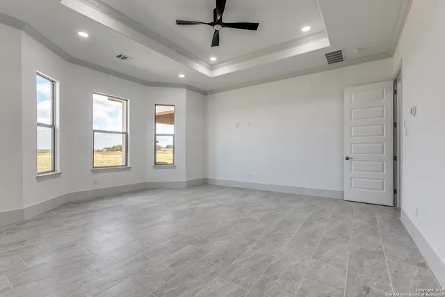 a view of an empty room with a window