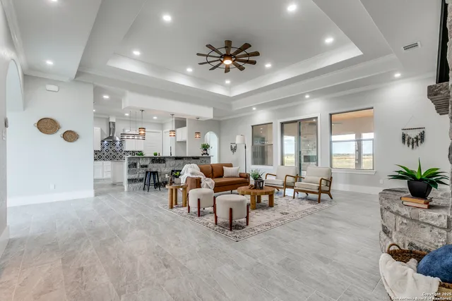 a living room with furniture and a large window