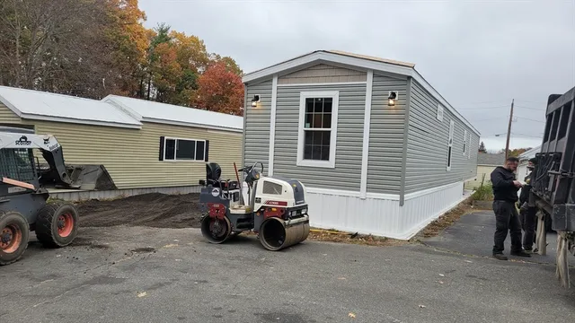 a view of a car park in front of house