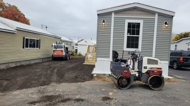a blue house with trees in front of it