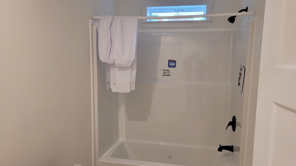 286 Newbury Street, Unit 110 Peabody, MA 01960 - Photo 8 of 15 a bathroom with a shower