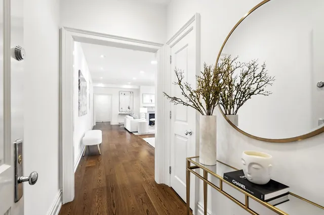 a very nice looking room with wooden floor and furniture