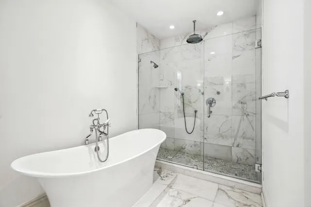 a bathroom with granite countertop a sink and a mirror