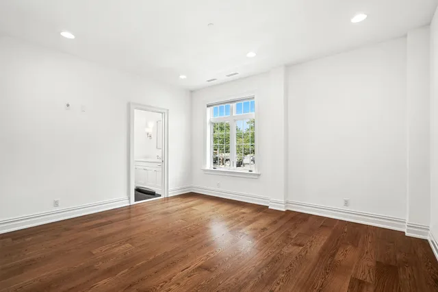 a bathroom with a granite countertop sink toilet a mirror and shower