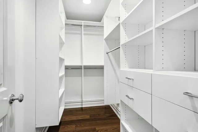 a bathroom with a toilet and a shower curtain