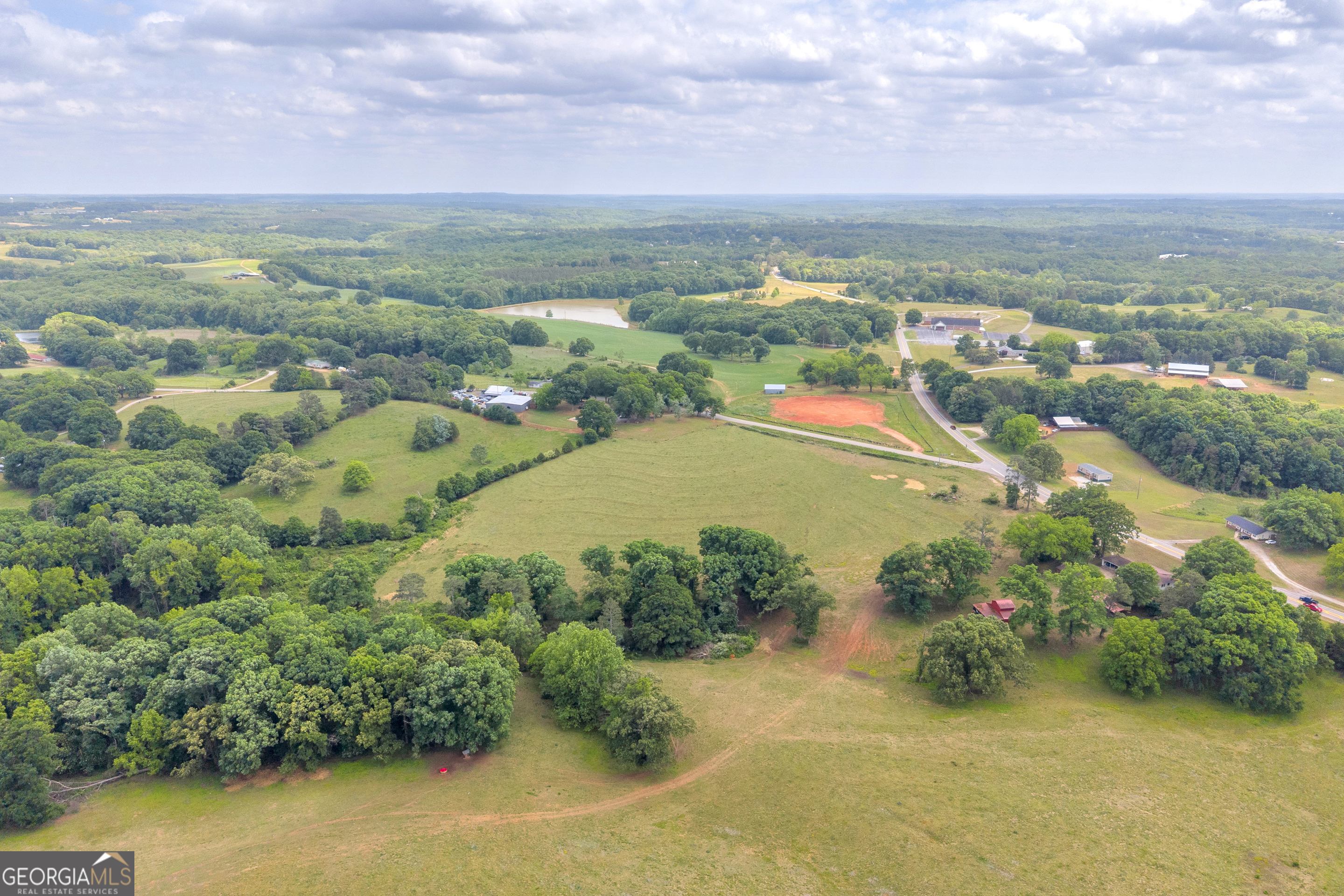 6490 Highway 145 Carnesville, GA 30521 - Photo 7 of 29 an aerial view of residential houses with outdoor space and trees