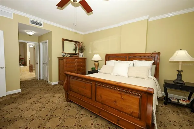 a bed room with a bed and a chair