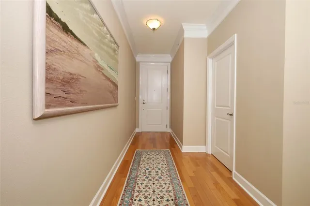 a view of a balcony with furniture and wooden floor