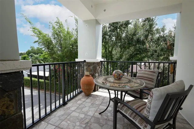a view of parking garage with cars and parked cars