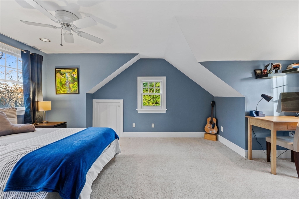 21 Rockridge Road Wellesley, MA 02481 - Photo 13 of 18 a bedroom with a bed and a chandelier