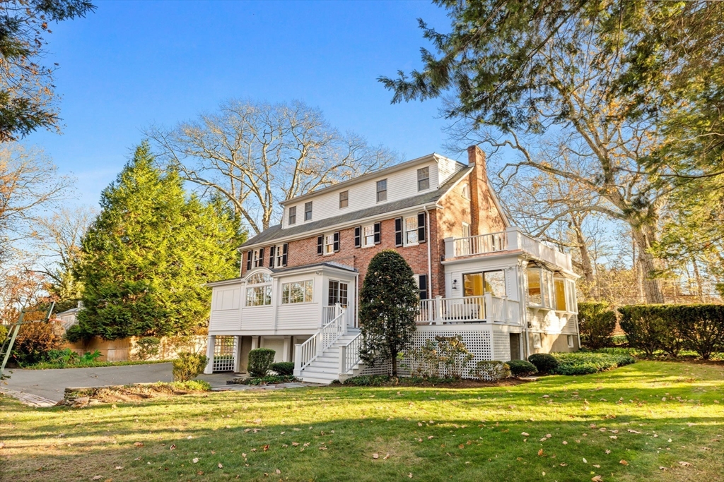 21 Rockridge Road Wellesley, MA 02481 - Photo 15 of 18 a front view of a building with a garden