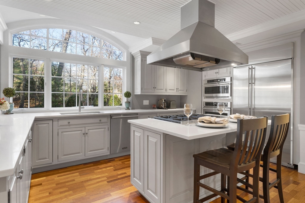 21 Rockridge Road Wellesley, MA 02481 - Photo 3 of 18 a kitchen with a stove a table and chairs