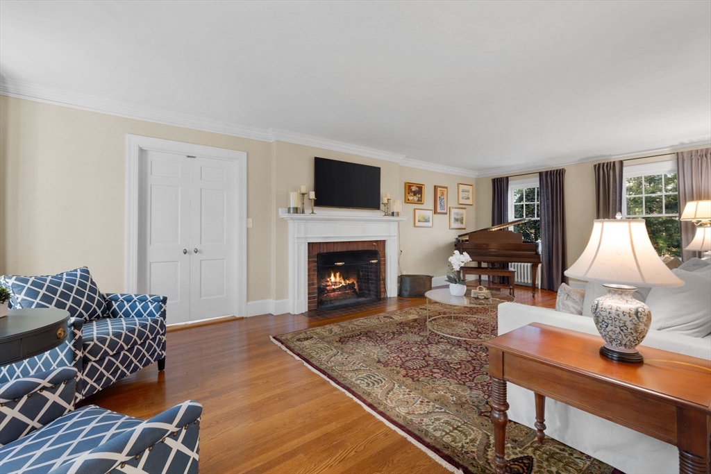 21 Rockridge Road Wellesley, MA 02481 - Photo 7 of 18 a living room with furniture fireplace and flat screen tv