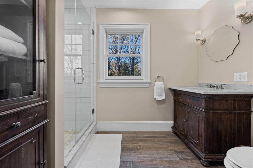 21 Rockridge Road Wellesley, MA 02481 - Photo 10 of 18 a bathroom with a sink a toilet and shower
