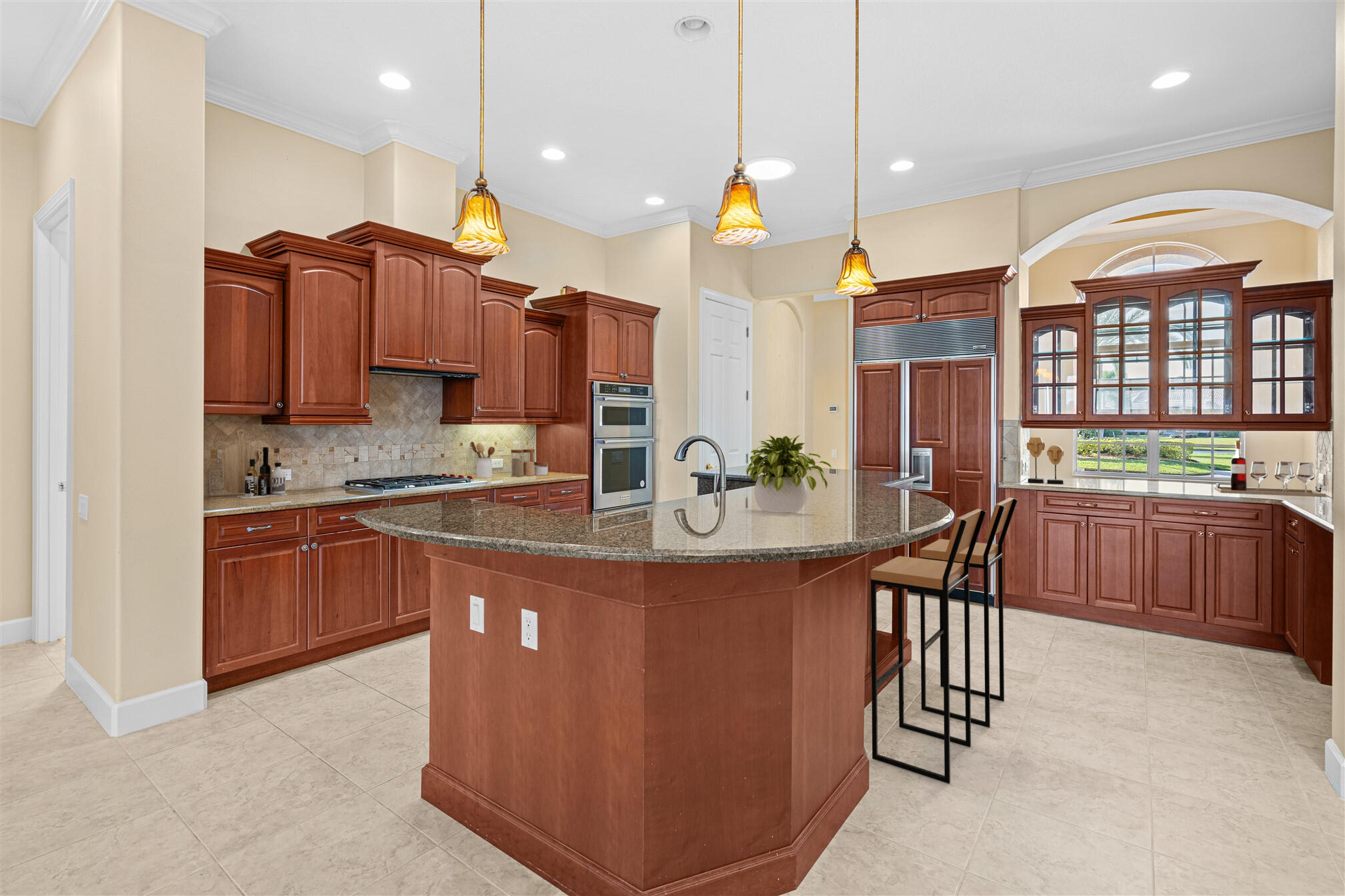 2863 BELLWIND Circle Rockledge, FL 32955 - Photo 17 of 79 a kitchen with stainless steel appliances kitchen island granite countertop a stove a sink and a refrigerator