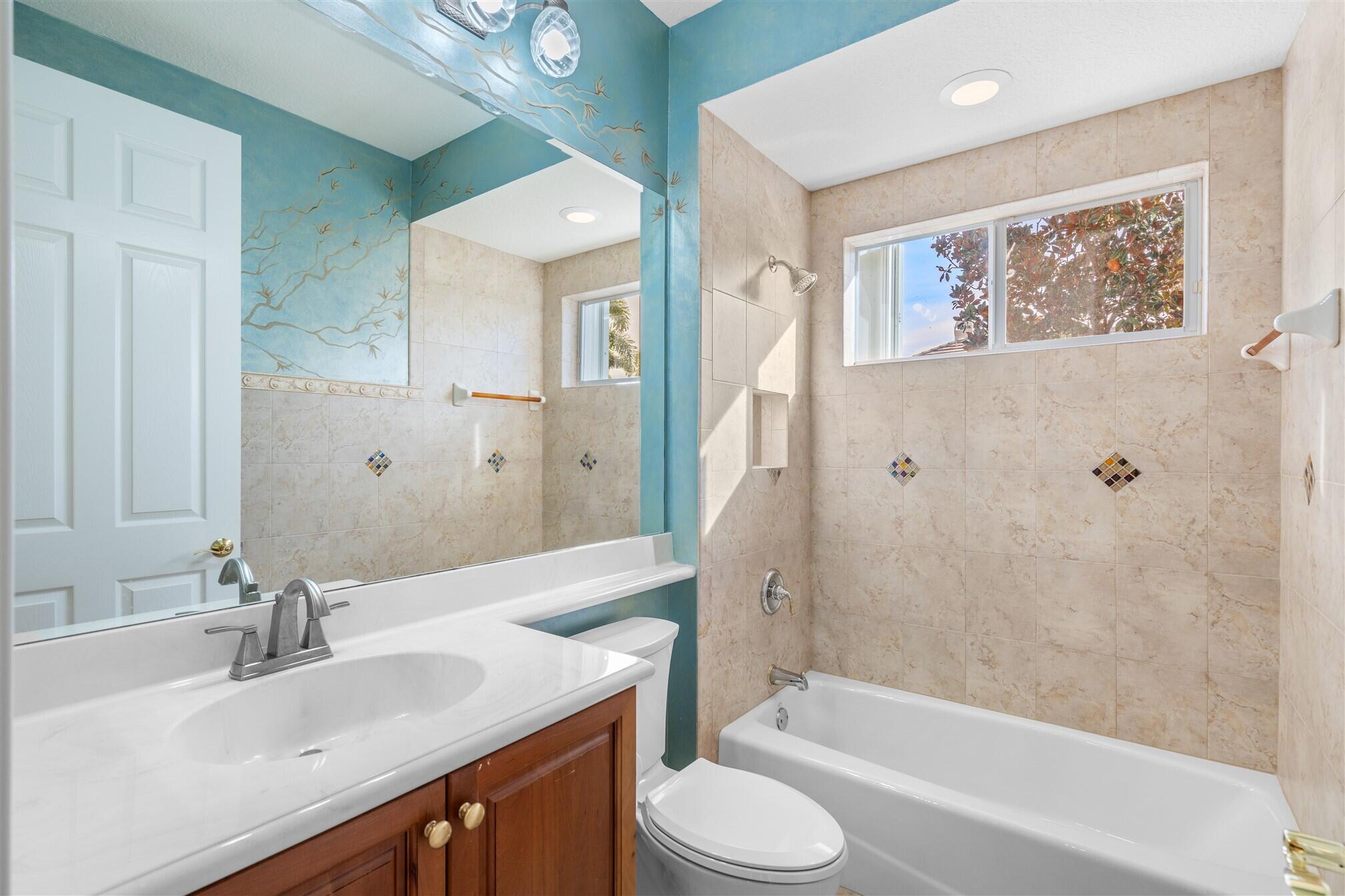 2863 BELLWIND Circle Rockledge, FL 32955 - Photo 42 of 79 a bathroom with a granite countertop sink toilet and shower