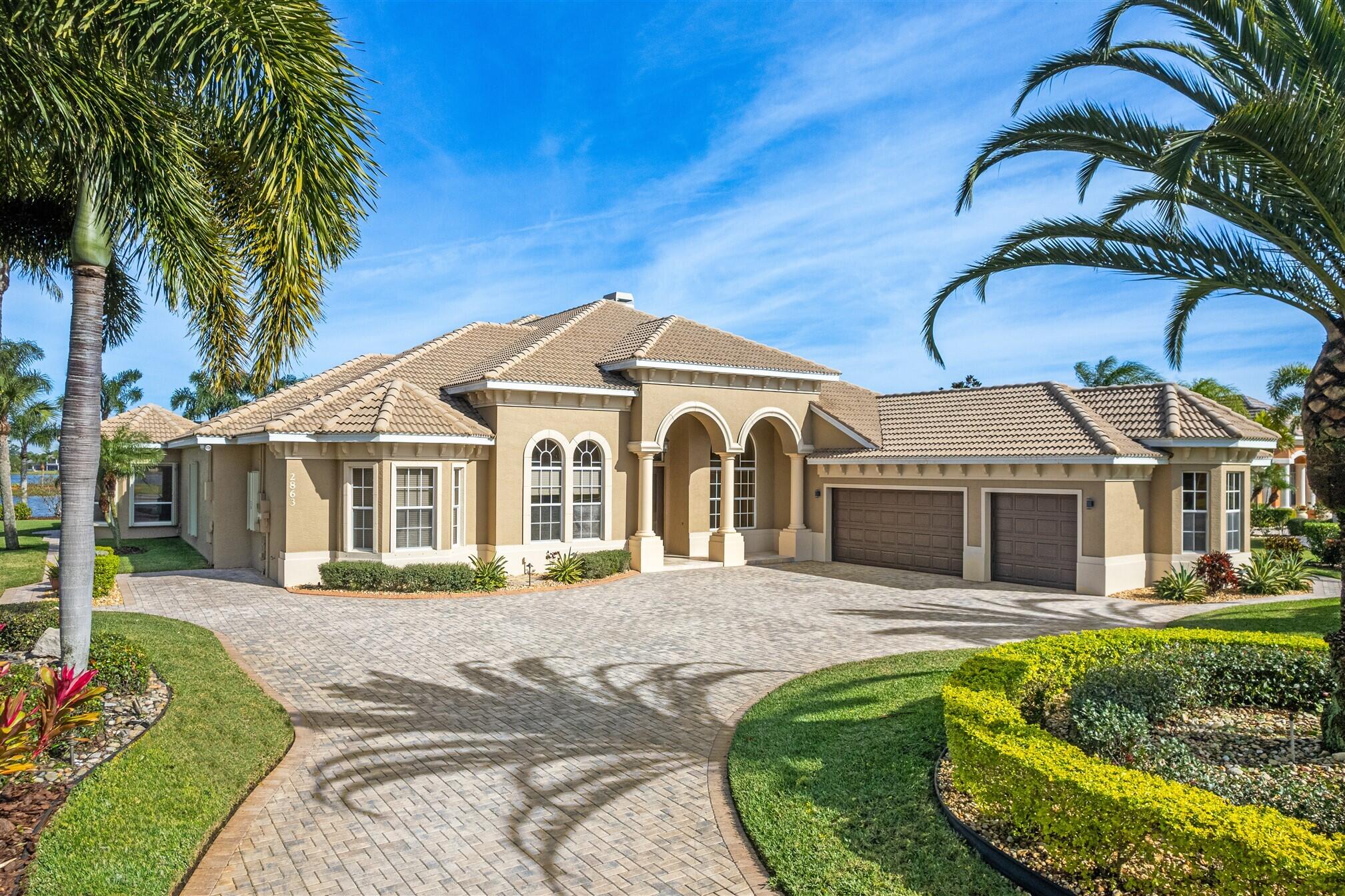 2863 BELLWIND Circle Rockledge, FL 32955 - Photo 5 of 79 a front view of a house with garden