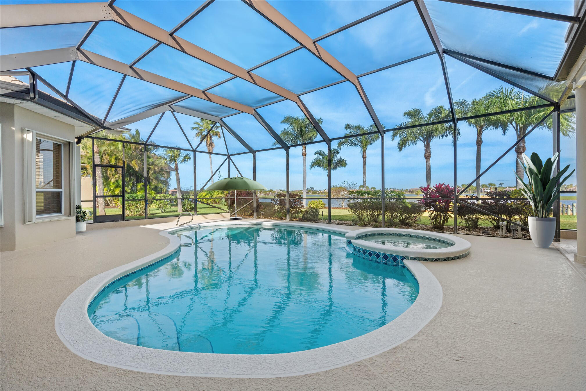 2863 BELLWIND Circle Rockledge, FL 32955 - Photo 57 of 79 a view of a swimming pool with a porch