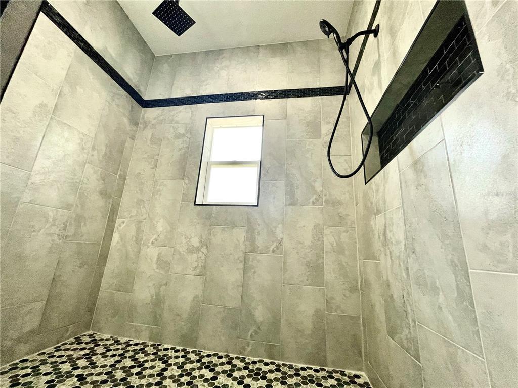 314 15th Avenue Ocoee, FL 34761 - Photo 11 of 37 a bathroom with a shower