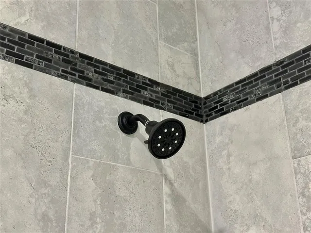 a bathroom with a glass shower door