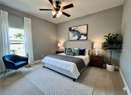 a bedroom with a bed and painting on the wall