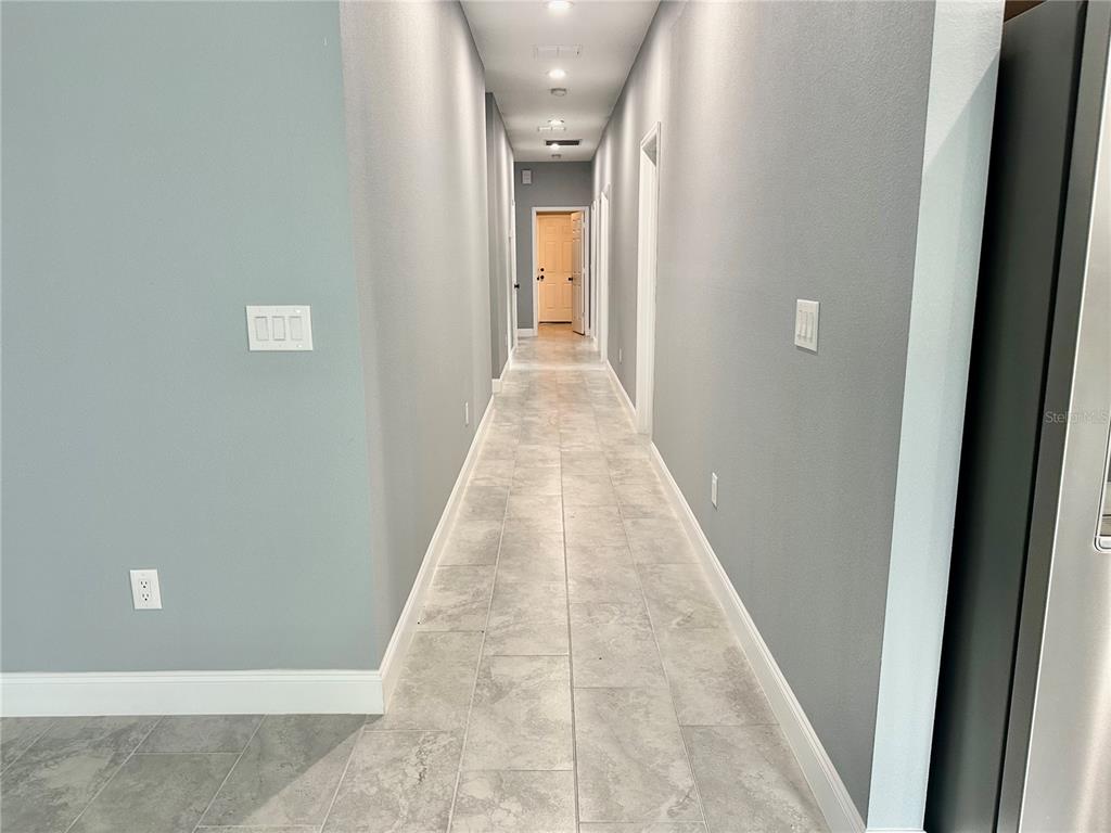 314 15th Avenue Ocoee, FL 34761 - Photo 25 of 37 en view of a hallway with wooden floor