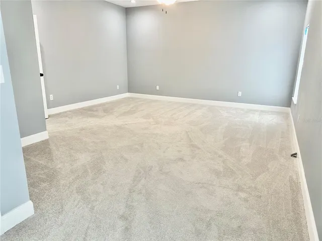 a view of a kitchen with a sink and cabinets