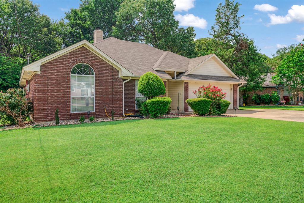 566 Turtle Creek Drive Reno, TX 75462 - Photo 18 of 19 Ranch-style home with concrete driveway, a front lawn, and brick siding