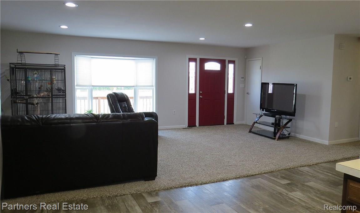 4850 Deal Road Fowlerville, MI 48836 - Photo 14 of 49 Large Bay Window and Recessed Ceiling Lights featured in Main Living Area of Home