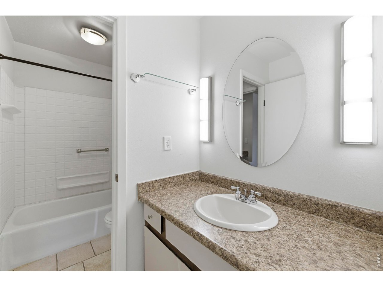 925 Columbia Road, Unit 824 Fort Collins, CO 80525 - Photo 17 of 36 a bathroom with a sink and a mirror