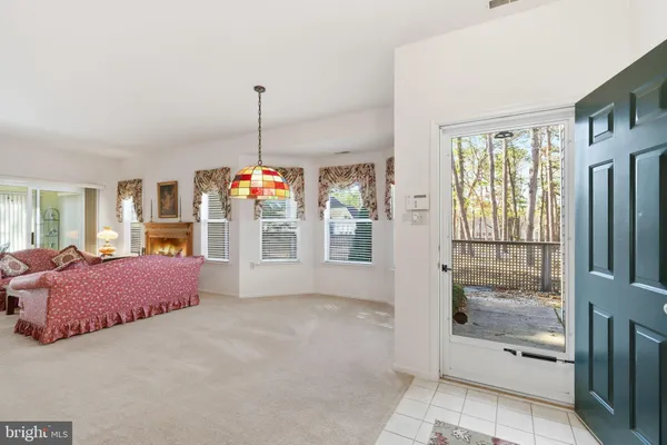 a spacious bedroom with furniture and windows