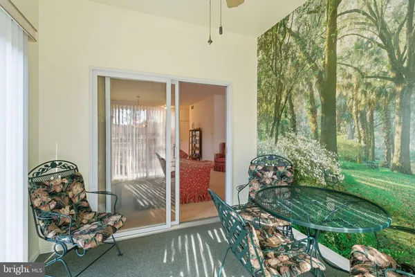 a room with garden view and outdoor seating