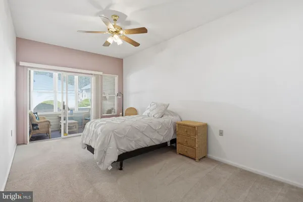 a bed room with a bed and a large window