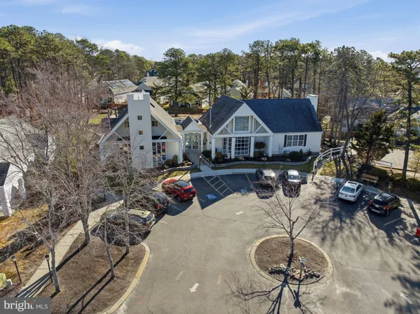 an aerial view of houses with yard