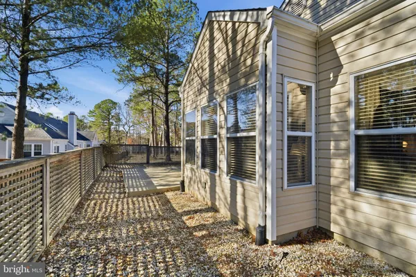 a view of a pathway with a wrought fence