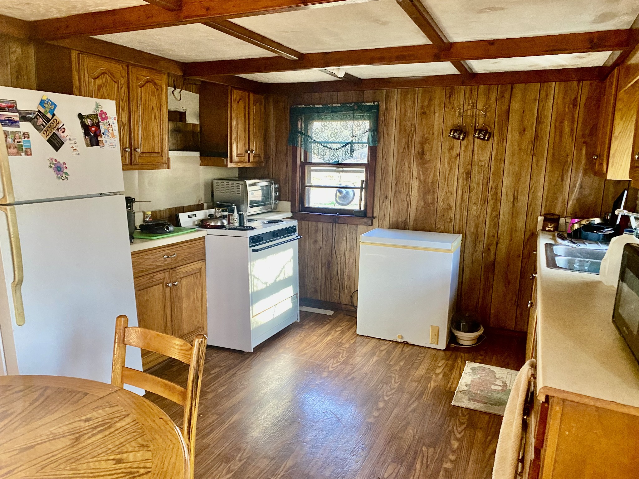 14 D Sain Road Manchester, TN 37355 - Photo 3 of 17 a kitchen with granite countertop a refrigerator and a stove
