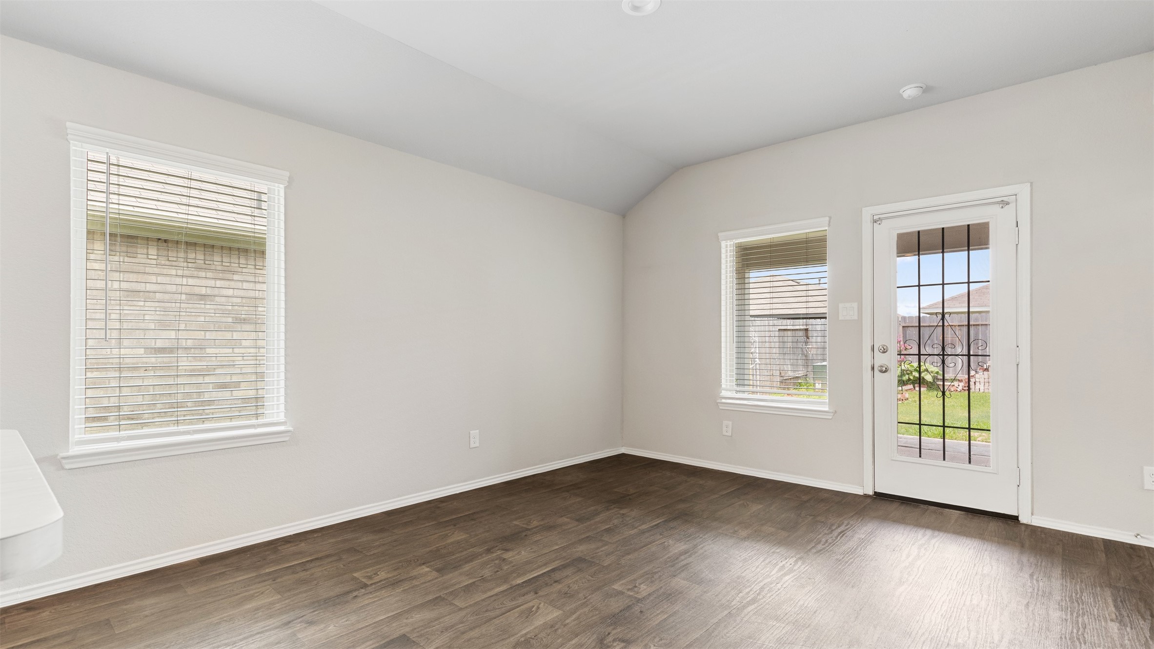 2311 Silver Plume Lane Spring, TX 77373 - Photo 11 of 24 an empty room with wooden floor and windows
