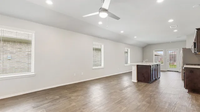 a view of kitchen with furniture and wooden floor