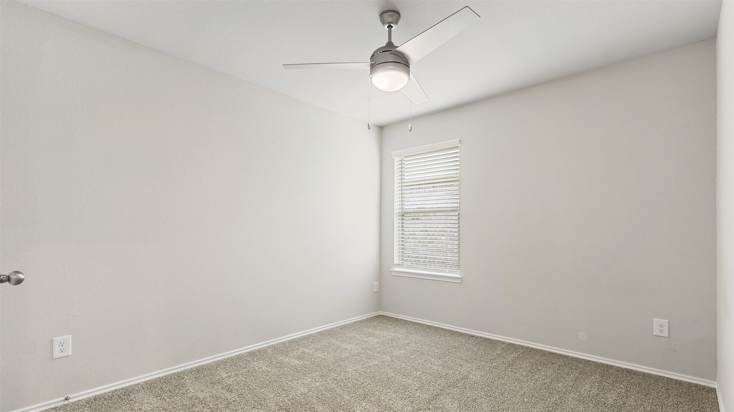2311 Silver Plume Lane Spring, TX 77373 - Photo 16 of 24 an empty room with windows and fan