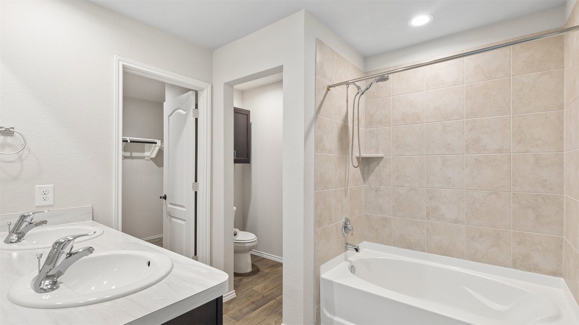 2311 Silver Plume Lane Spring, TX 77373 - Photo 19 of 24 a white bath tub sitting next to a white sink and a mirror